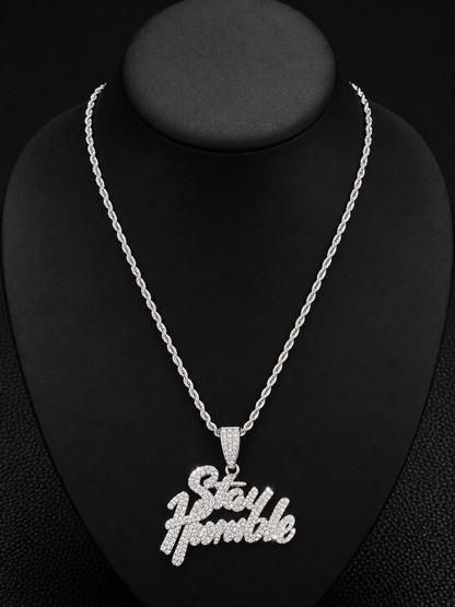 Stay Humble Rhinestone Necklace & Pendant

Add elegance and sparkle to your jewelry collection with this beautiful silver-tone Stay Humble necklace. Featuring a stunning rhinestone-encrusted lettering pendant and a stylish matching chain, this eye-catchin
